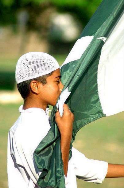 Pakistan-Flag-Lovers-A-little-boy-kissing-Pakistani-flag-Display-of-Pakistani-flag
