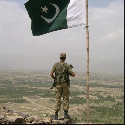 Pakistan-Flag-Lovers-A-soldier-guarding-border-post-under-a-waving-Pakistani-flag-Display-of-Pakistani-flag